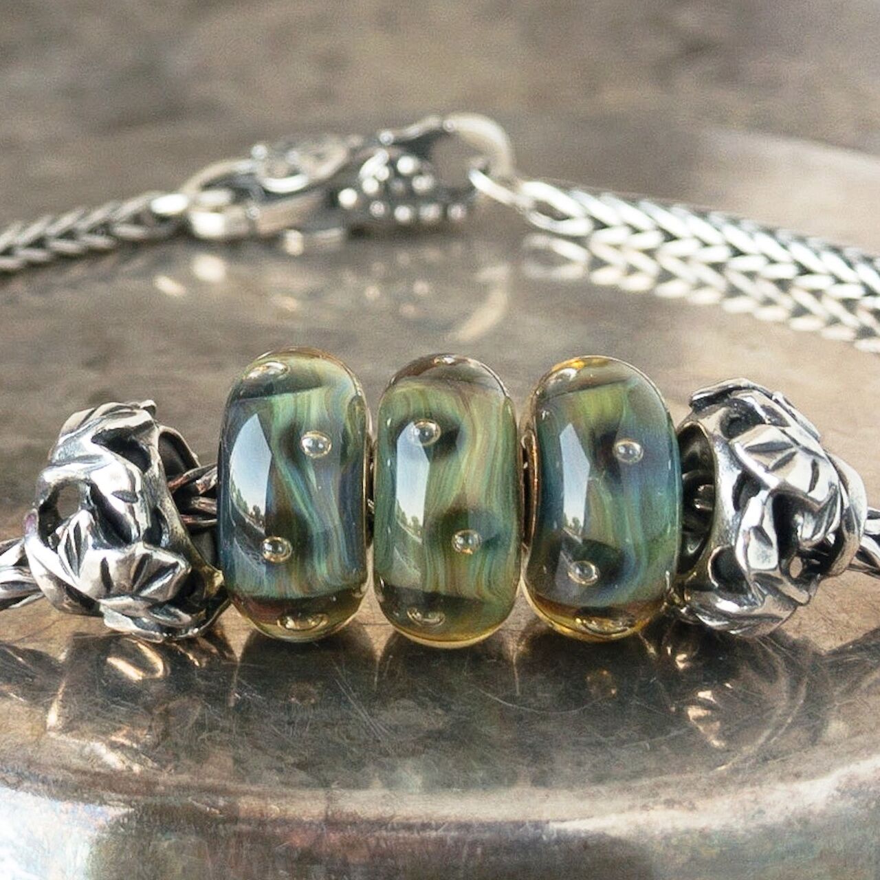 3 versions of Trollbeads glass bead "Organic Bubbles" on a Trollbeads sterling bracelet 