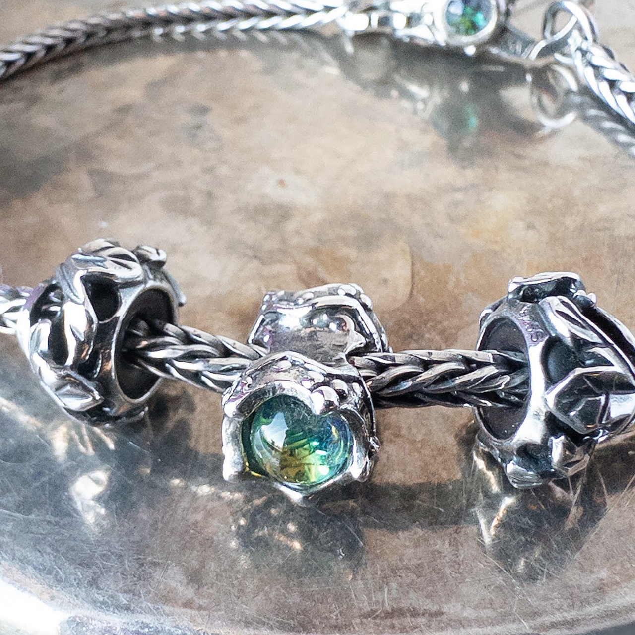 Retired Trollbeads "King and Queen" bead on a sterling silver bracelet.