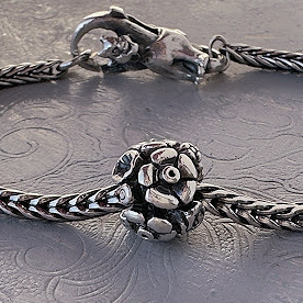 Trollbeads "Anniversary Flowers" sterling silver bead available at Suzie Q Studio