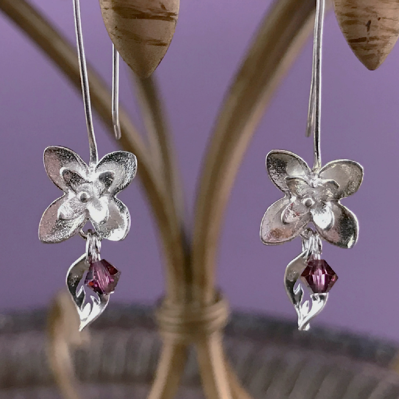 A pair of handcrafted, sterling silver flower earrings, with Swarovski crystal beads, on sale at Suzie Q Studio