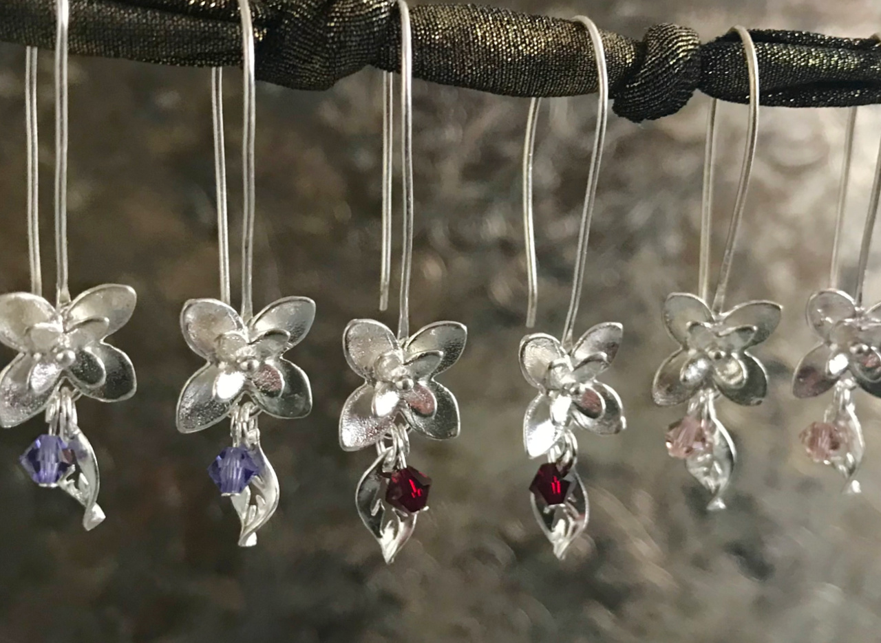 Three pairs of handcrafted, sterling silver flower earrings, with Swarovski crystal beads, on sale at Suzie Q Studio
