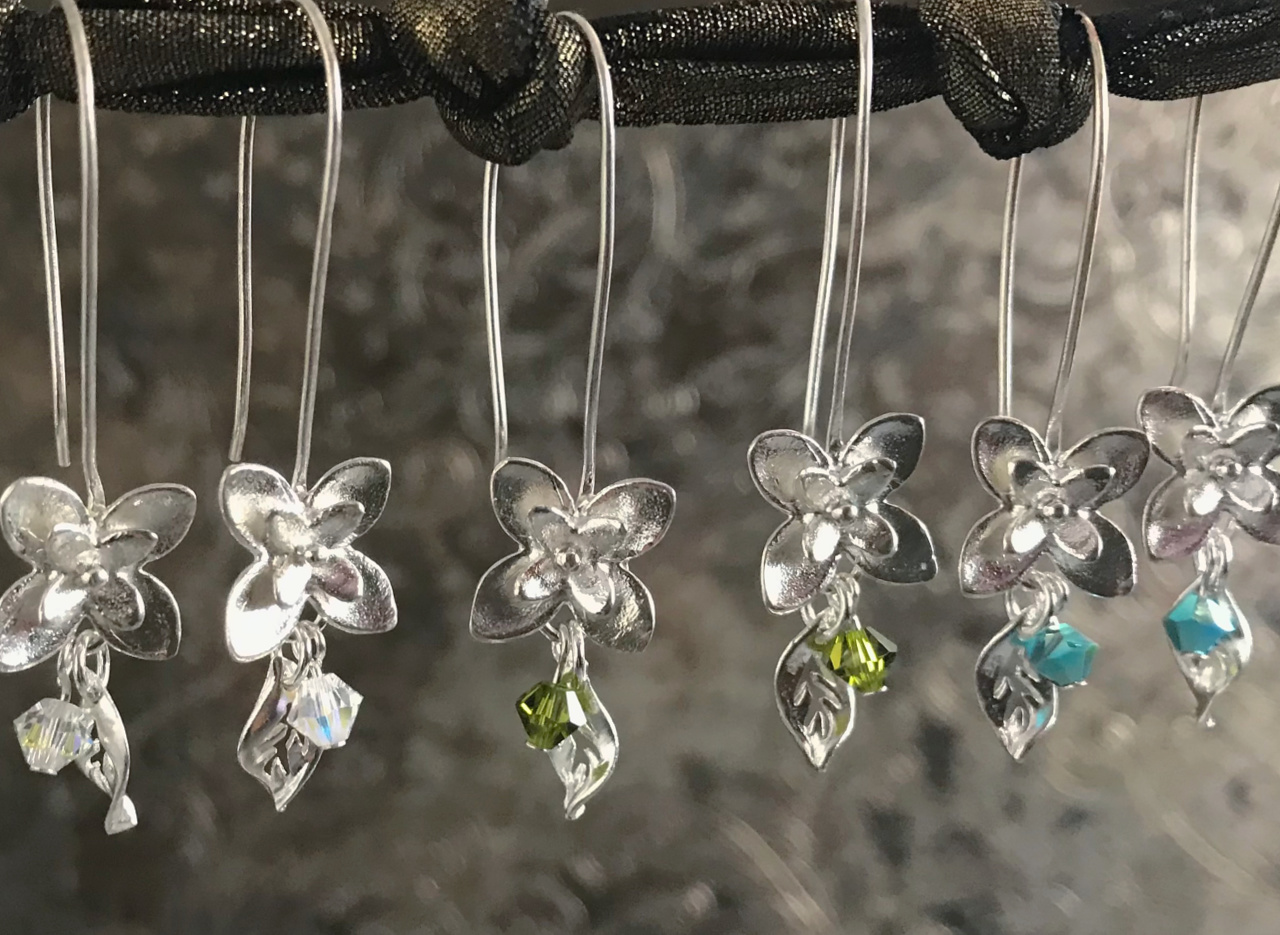 Three pairs of handcrafted, sterling silver flower earrings, with Swarovski crystal beads, on sale at Suzie Q Studio