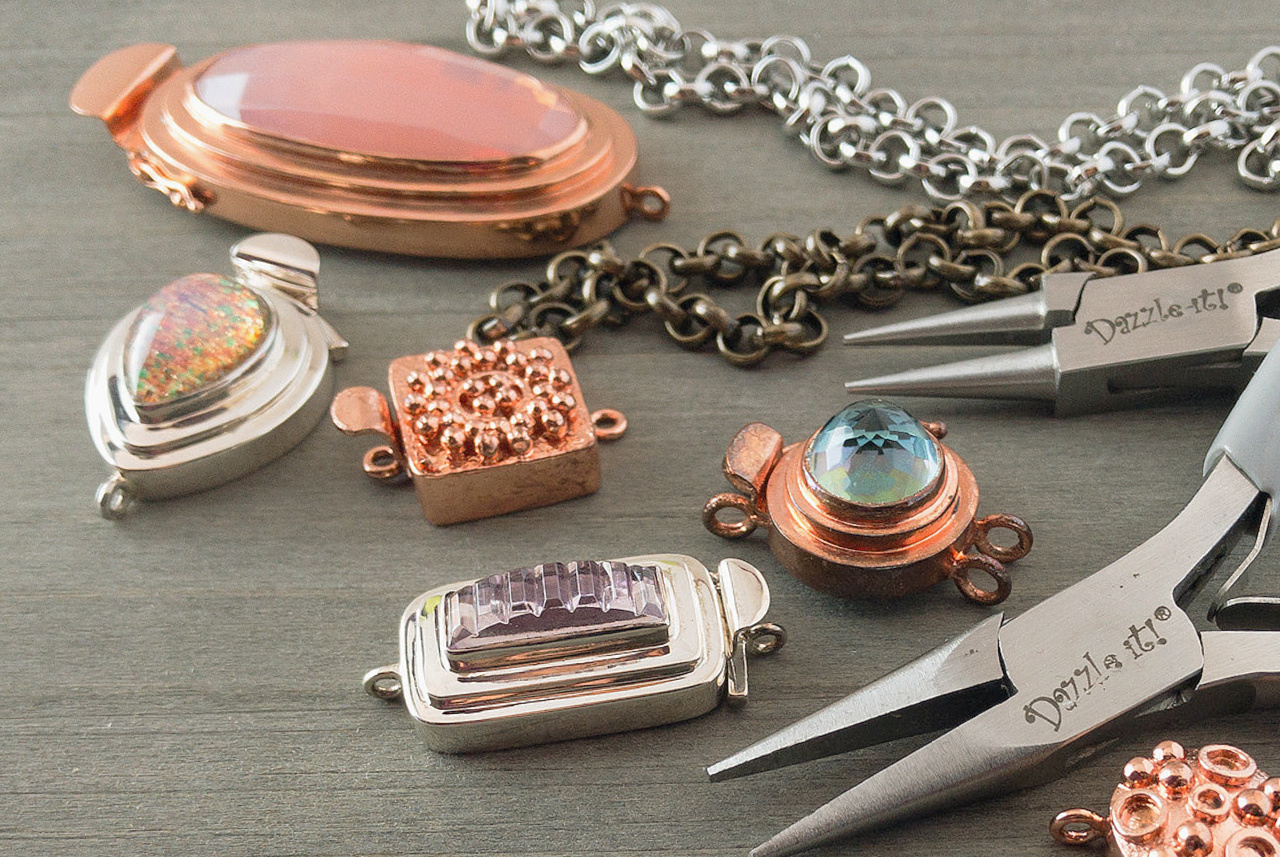 Image of custom, sterling silver and copper "box-style" jewellery clasps, with tools and jewellery chain.