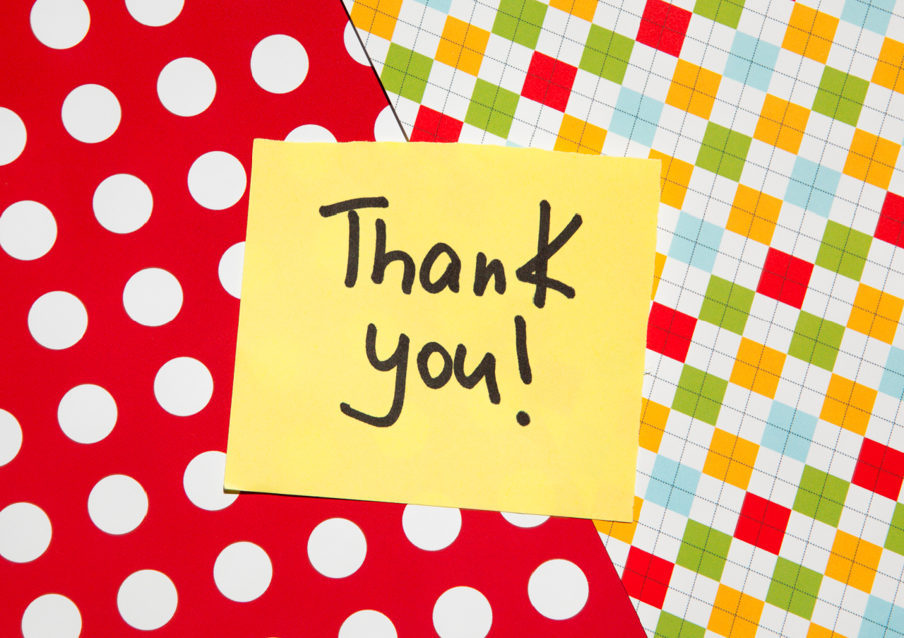 A bright, patterned background with a yellow post it note that says: "Thank you!"